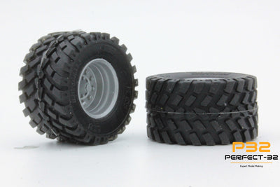 Two off-road tires with tread patterns on a white background