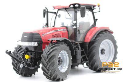 Model of a red tractor on a white background