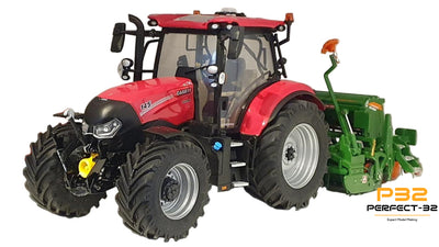 Model tractor with attachments on a white surface
