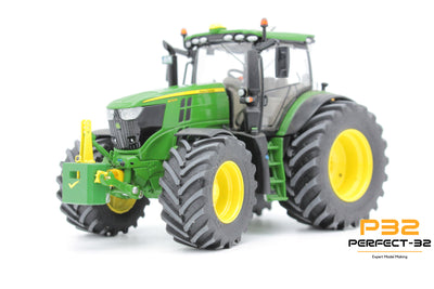 Model of a green tractor with large wheels
