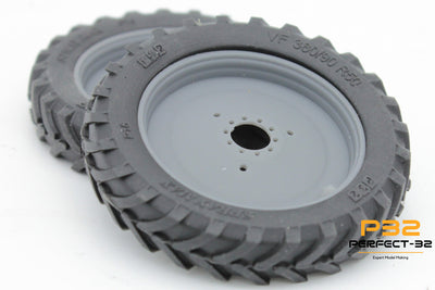 Gray wheel with a thick tread on a white background